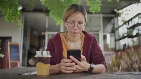 Young casual woman looking at camera Stock Footage 198296878