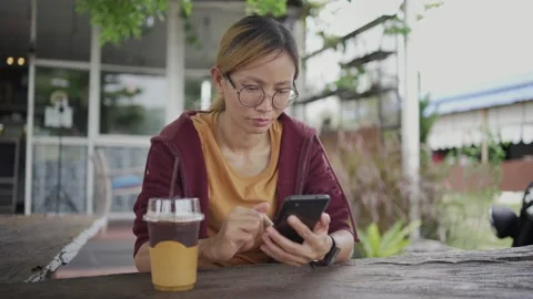 Young casual woman looking at camera Stock Footage 198296930