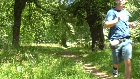Young Casually Dressed Man Jogging in Park Stock Footage 96738403