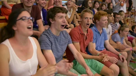 Young Catholics in the Stands rooting for their Church Team - School Gym Stock Footage 66312458