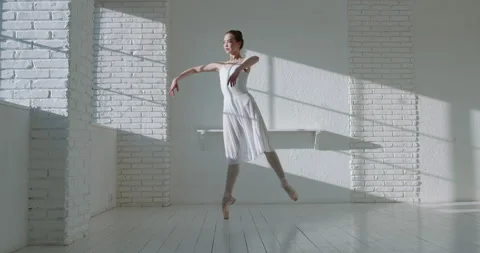 Young caucasian ballerina dancing in studio. Talented attractive girl practicing Видео 154875368