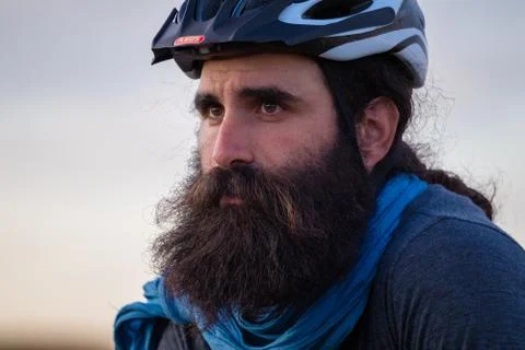 Young caucasian bearded man wearing a bike helmet Stock Photos