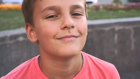 Young caucasian boy looking at camera and smiling. Stock Footage 91165161