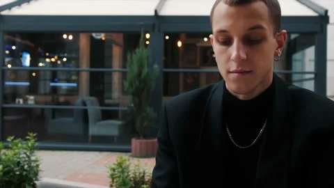 Young caucasian businessman using computer laptop for his work at outside office Stock Footage 143878887