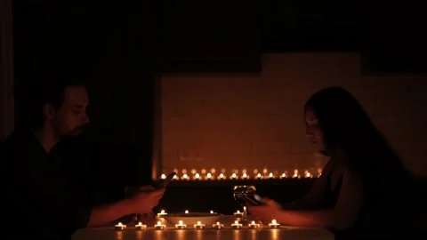 Young caucasian couple using their phones during romantic dinner Stock Footage 159548642