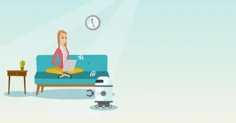 Young caucasian engineer programming a robot. 스톡 일러스트