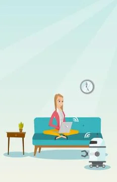 Young caucasian engineer programming a robot. 스톡 일러스트