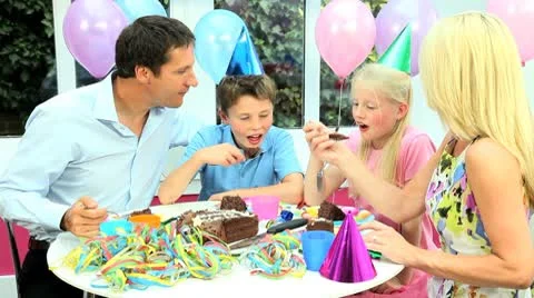 Young Caucasian Family Enjoying Birthday Cake Stock Footage