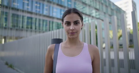 Young Caucasian female model happy going to gym reopened after lockdown walks to Stock Footage 159727123