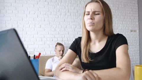 Young caucasian freelancer colleagues using laptop and upsetting for bad news Stock Footage 111753058