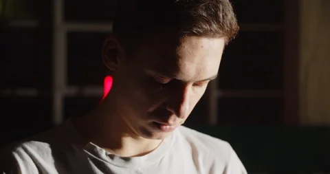 Young caucasian guy getting ready to step backstage darkness light spotlight Stock Footage 126230250