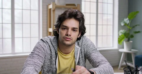 Young caucasian guy having a video chat. Positive man talking with his friends Video stock 137470313