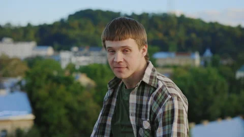 Young caucasian handsome dancer performing hip hop outside on the roof. Brunette Stock Footage 245167269
