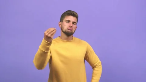 Young caucasian handsome man doing a typical italian gesture, smiling and Stock Footage 138662733