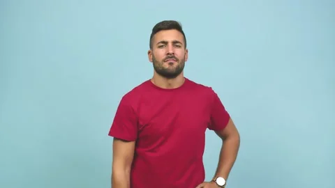 Young caucasian handsome man doing a typical italian gesture, smiling and Stock Footage 138665728