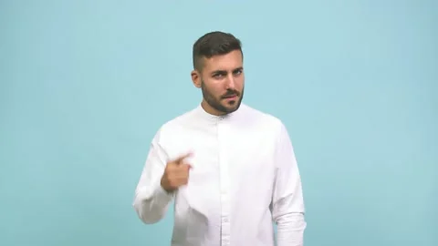 Young caucasian handsome man doing a concentration gesture, looking straight Stock Footage 138665867