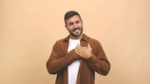 Young caucasian handsome man doing a romantic gesture, in love with someone or Stock Footage 138666905