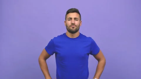 Young caucasian handsome man looking forward, scolding someone very angry Stock Footage 138666376