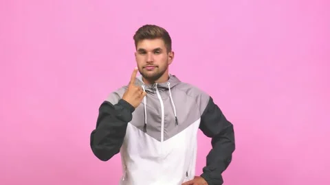 Young caucasian handsome man showing number one, symbol of counting, concept of Stock Footage 138662453