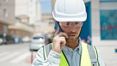 Young caucasian man architect smiling confident talking on smartphone at co.. Video stock 247380775