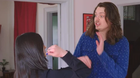 A young caucasian man being physically abused by his girlfriend - slow motion Stock Footage 129850474