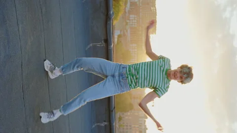 Young Caucasian Man Dancing and Having Fun at Rooftop with Cityscape on Stock Footage 240326445