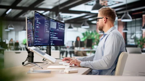 Young Caucasian Man Developing Software Using Computer Stock Footage 328390800