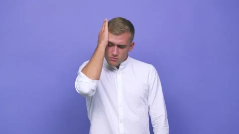 Young caucasian man forgetting something, slapping forehead with palm and Video stock 140020003
