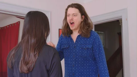 A young caucasian man physically abusing his girlfriend Stock Footage 129336939