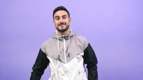 Young caucasian man pointing to the side, smiling surprised presenting Stock Footage 138663913
