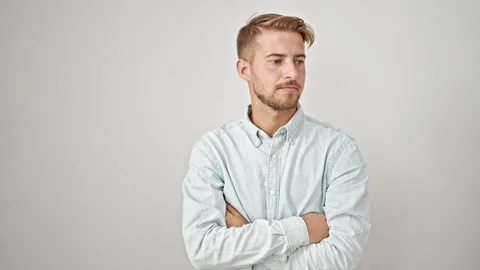 Young caucasian man receiving package smiling over isolated white background Video stock 247380627