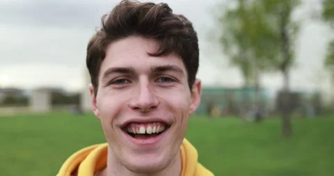 Young caucasian man smiling on camera outdoor Stock Footage 192383284