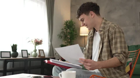 Young caucasian man student study at home learn exam or prepare lesson Stock Footage 264426329
