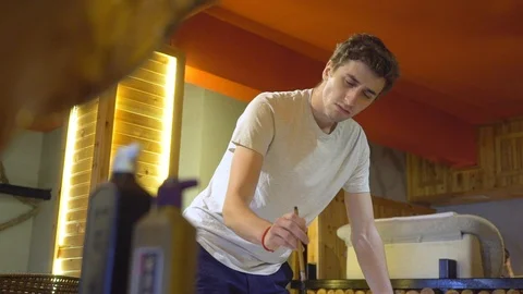 Young, caucasian man in a studio is busy working with a traditional Video stock 110831773