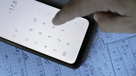 Young caucasian man study math with a pencil and his phone calculator Stock Footage 205603091