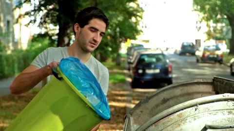 Young caucasian man throwing out trash from flat Stock-Footage 41507228