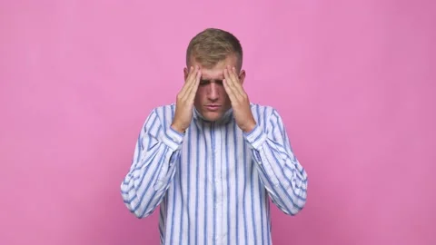Young caucasian man touching temples and having headache Stock Footage 140019837