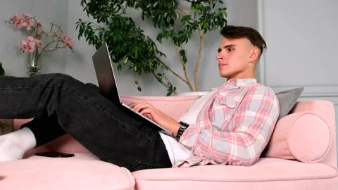 Young Caucasian man typing working on laptop computer Video stock 161838912