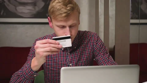 Young caucasian man using laptop Paying Online shopping by Credit Card. E Video stock 146601207