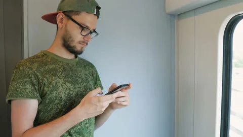 Young caucasian man using smart phone Stock Footage 111573409