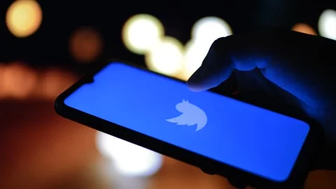 Young caucasian man using twitter app during night in the city Stock Footage 195291676