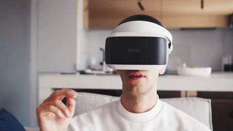 Young caucasian man Using Virtual Glasses And Working At Home With Cyber Space Video stock 138904410