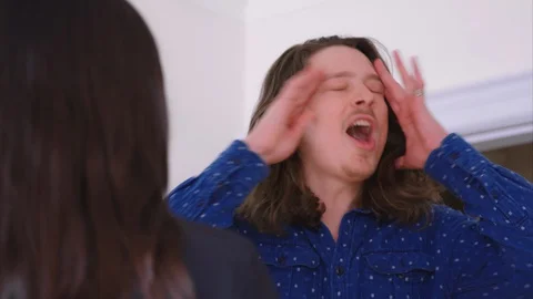 A young caucasian man verbally abusing his girlfriend Stock Footage 129337649