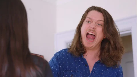 A young caucasian man verbally abusing his girlfriend - slow motion Stock Footage 129849903