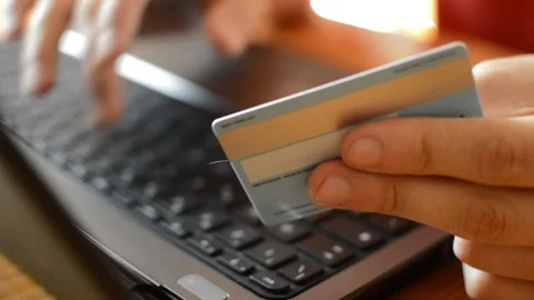 Young caucasian man's hand using credit card for amazon payment on laptop. Video stock 206044266
