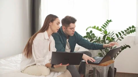 Young caucasian married couple using laptop. Stock Footage 131423128