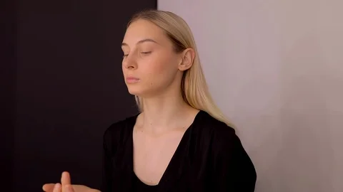 Young caucasian model applying professional makeup. beautiful woman applying Stock Footage 113865220