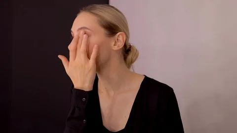 Young caucasian model applying professional makeup. beautiful woman applying Stock Footage 113912992