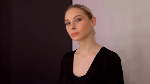 Young caucasian model applying professional makeup. beautiful woman applying Stock Footage 113913911