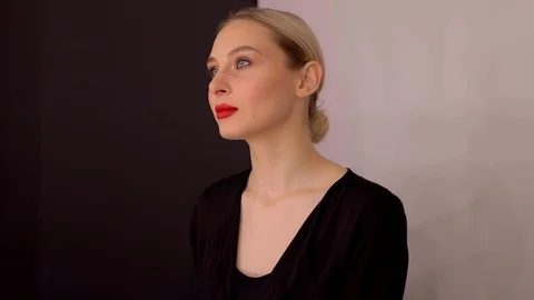 Young caucasian model applying professional makeup. beautiful woman applying Stock Footage 113914964